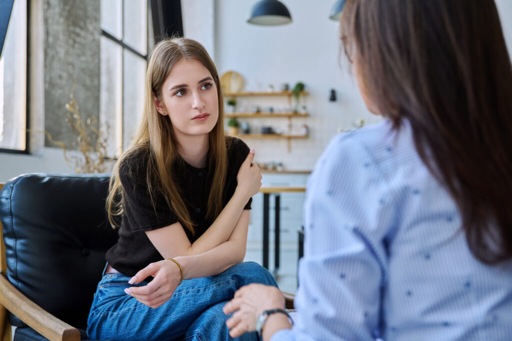 Young woman talking to a therapist