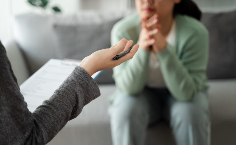 therapist listening and talking to a patient with anxiety