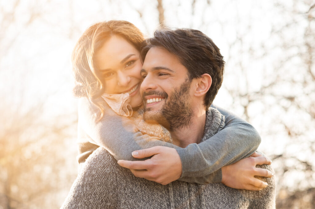 Closeup of smiling man and woman outdoors